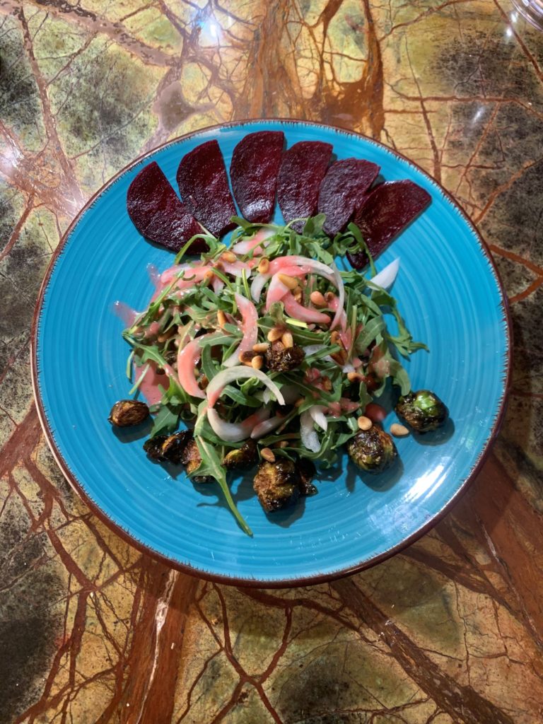 Roasted Beet, Pine nut, and crispy brussel sprout salad with blood orange vinaigrette