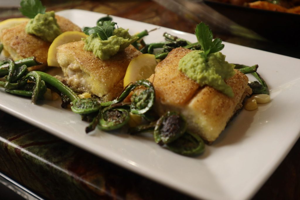 Corn Crusted Sea Bass with White Wine Spring Pea Puree and Sauteed fiddleheads