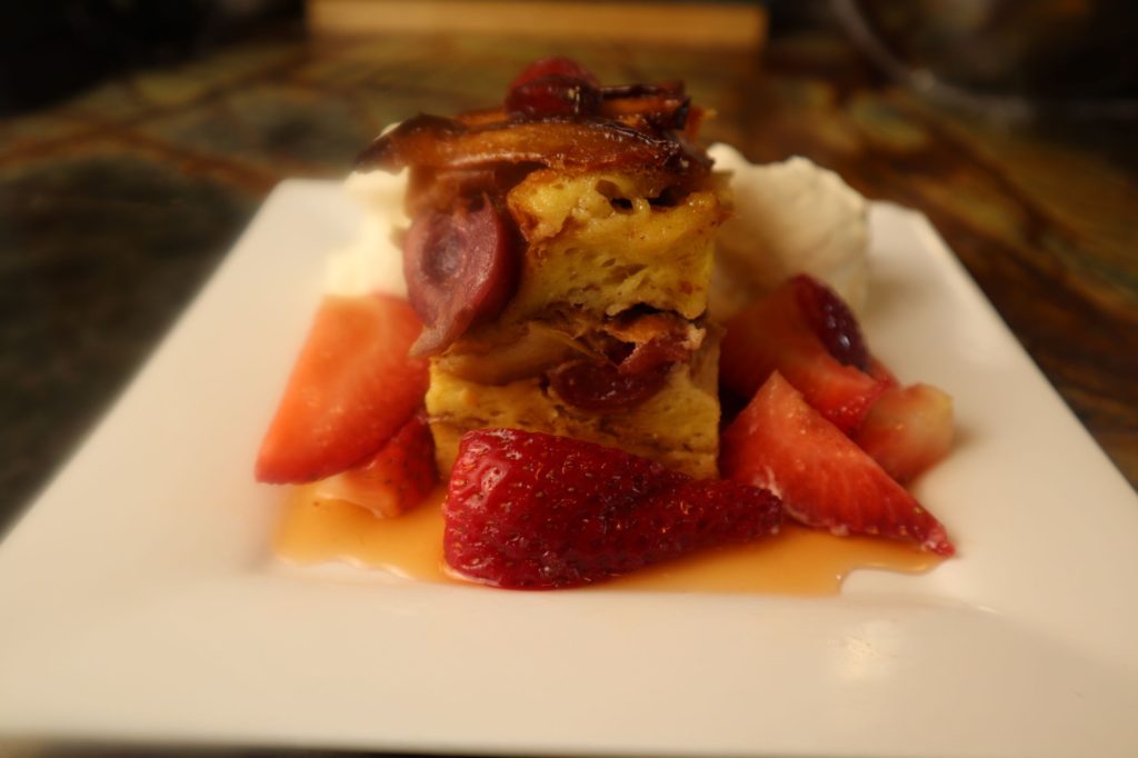 Apple and Cherry Strata with Macerated Strawberries and Whipped cream